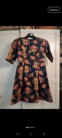 Piękna sukienka w kwiaty - taliowana, rozkloszowana r. 40