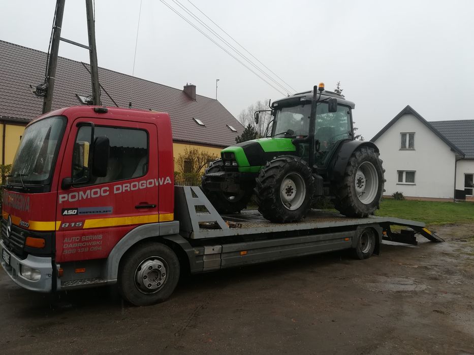 Transport maszyn rolniczych budowlanych pomoc drogowa laweta holowanie