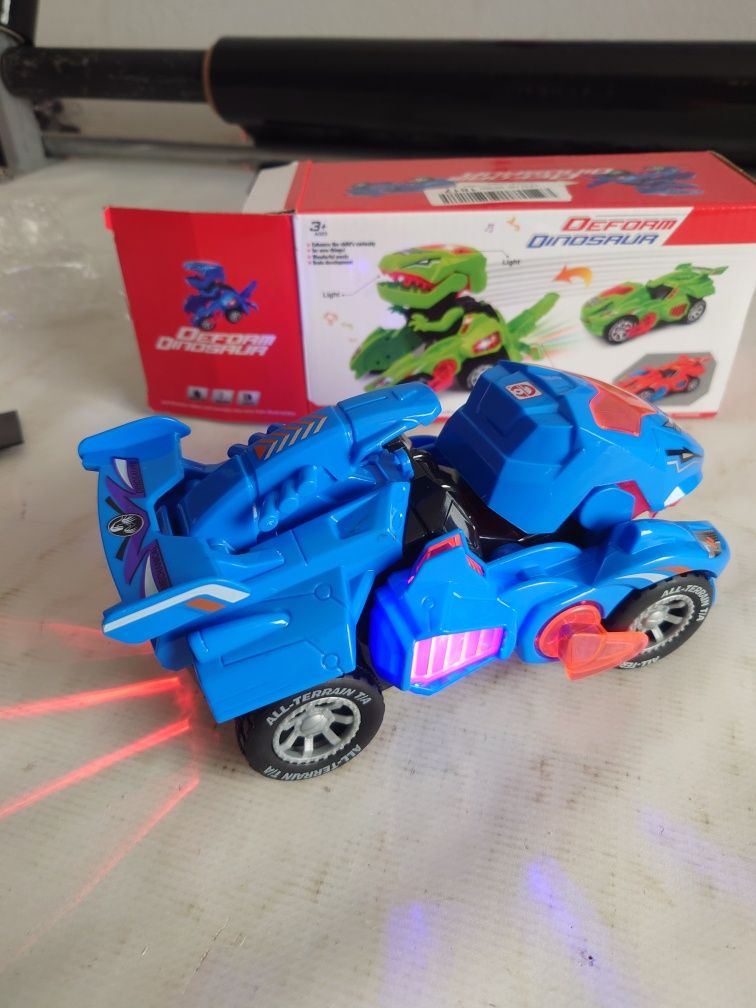 Samochód Dinozaur autko świecące na baterie Transformer wiek 3+