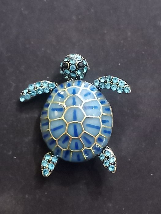 Pregadeira ou broche para casaco tartaruga ou flor