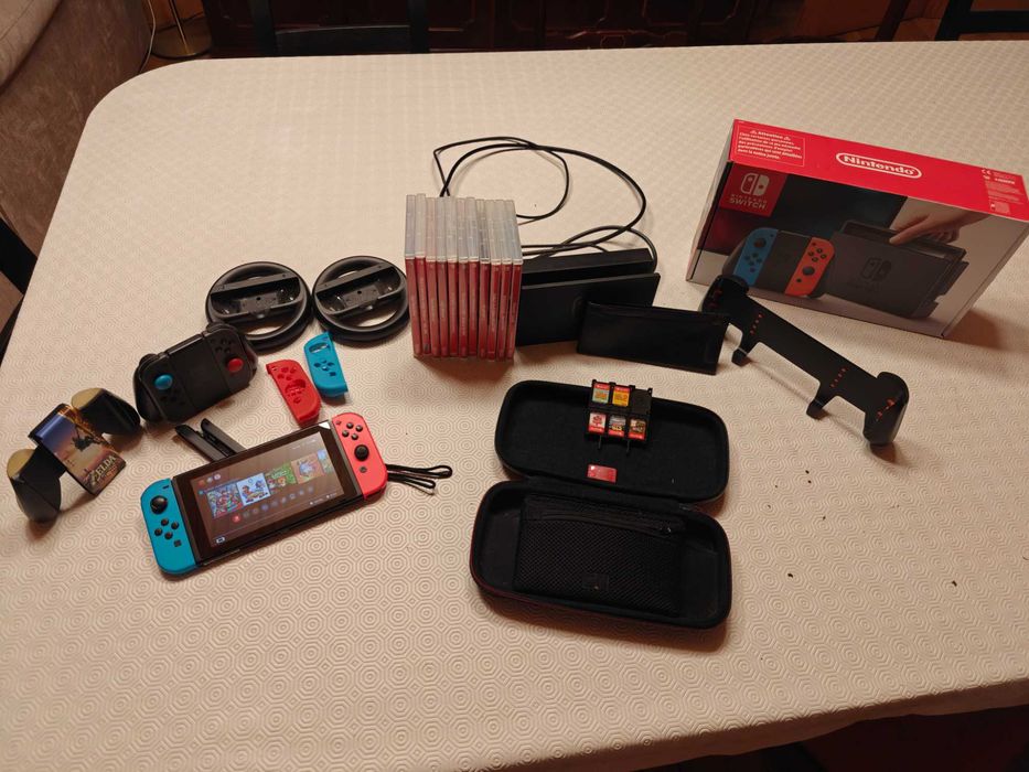 Nintendo Switch Consola + Caixa + Bolsa + Grip + Jogos