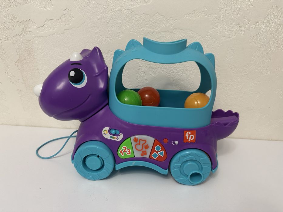 Іграшка-каталка від Fisher price Веселий трицерапторс