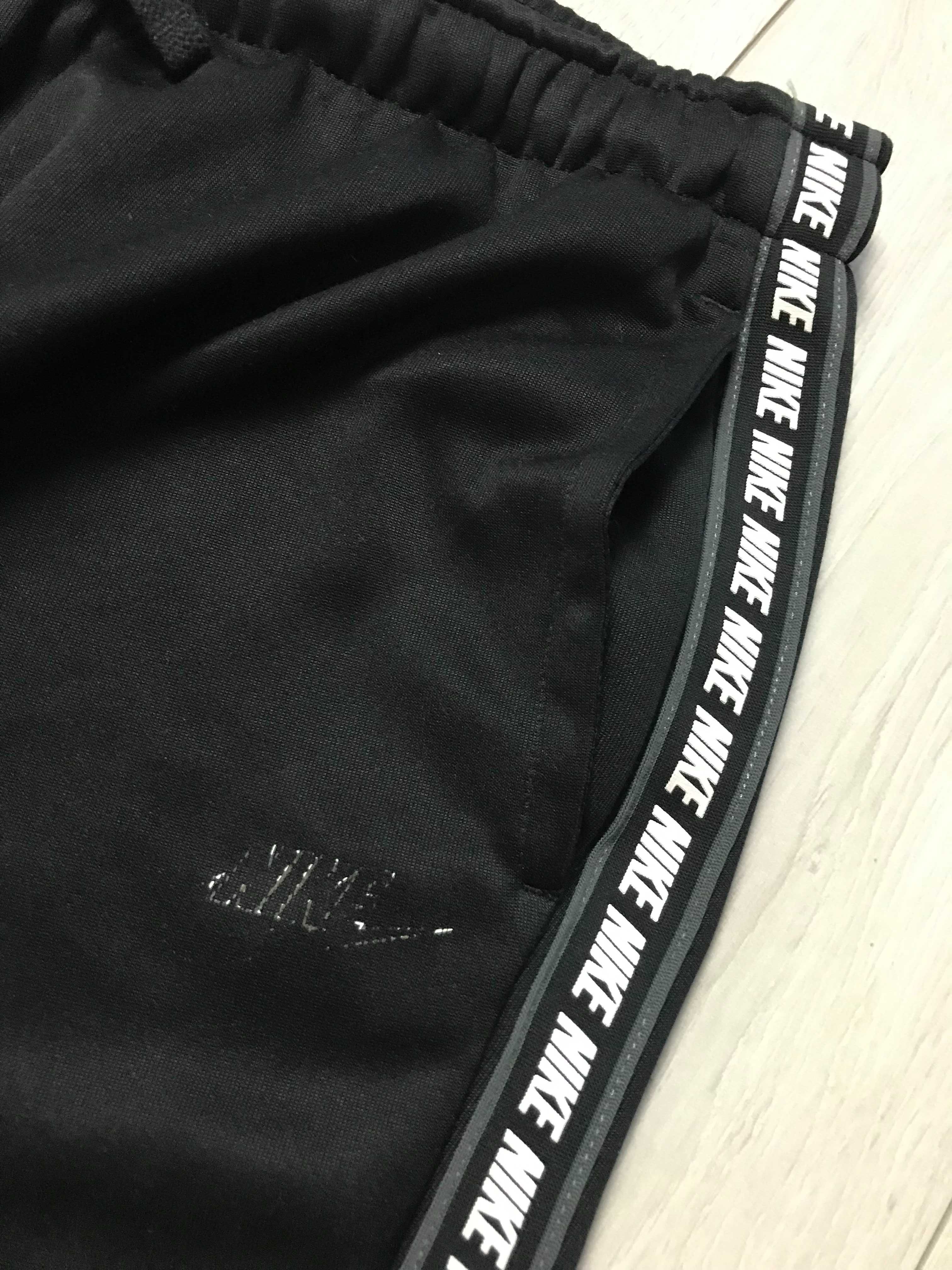 NIKE r.L oryginalne spodnie sportowe męskie