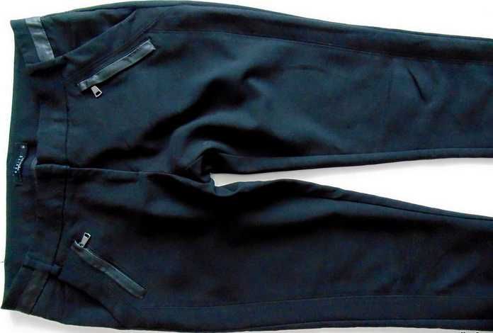 MOHITO gładkie efektowne spodnie z kieszeniami 36