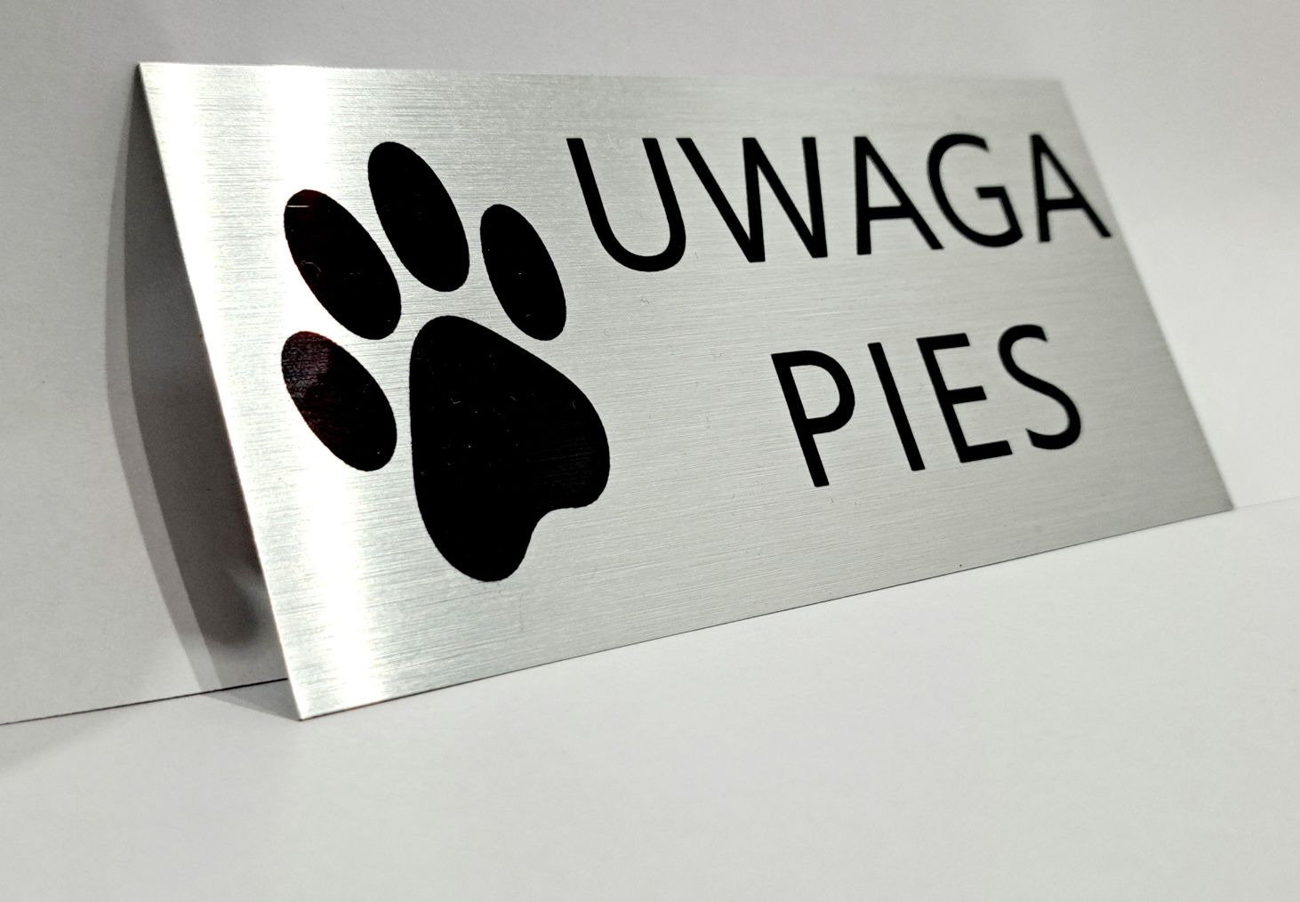 Srebrna tabliczka Uwaga Pies łapka