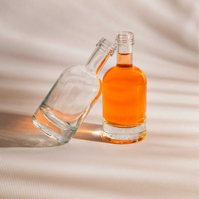 Zestaw 100x Butelka szklana TADEK 50ml na nalewki oliwę soki +zakrętki