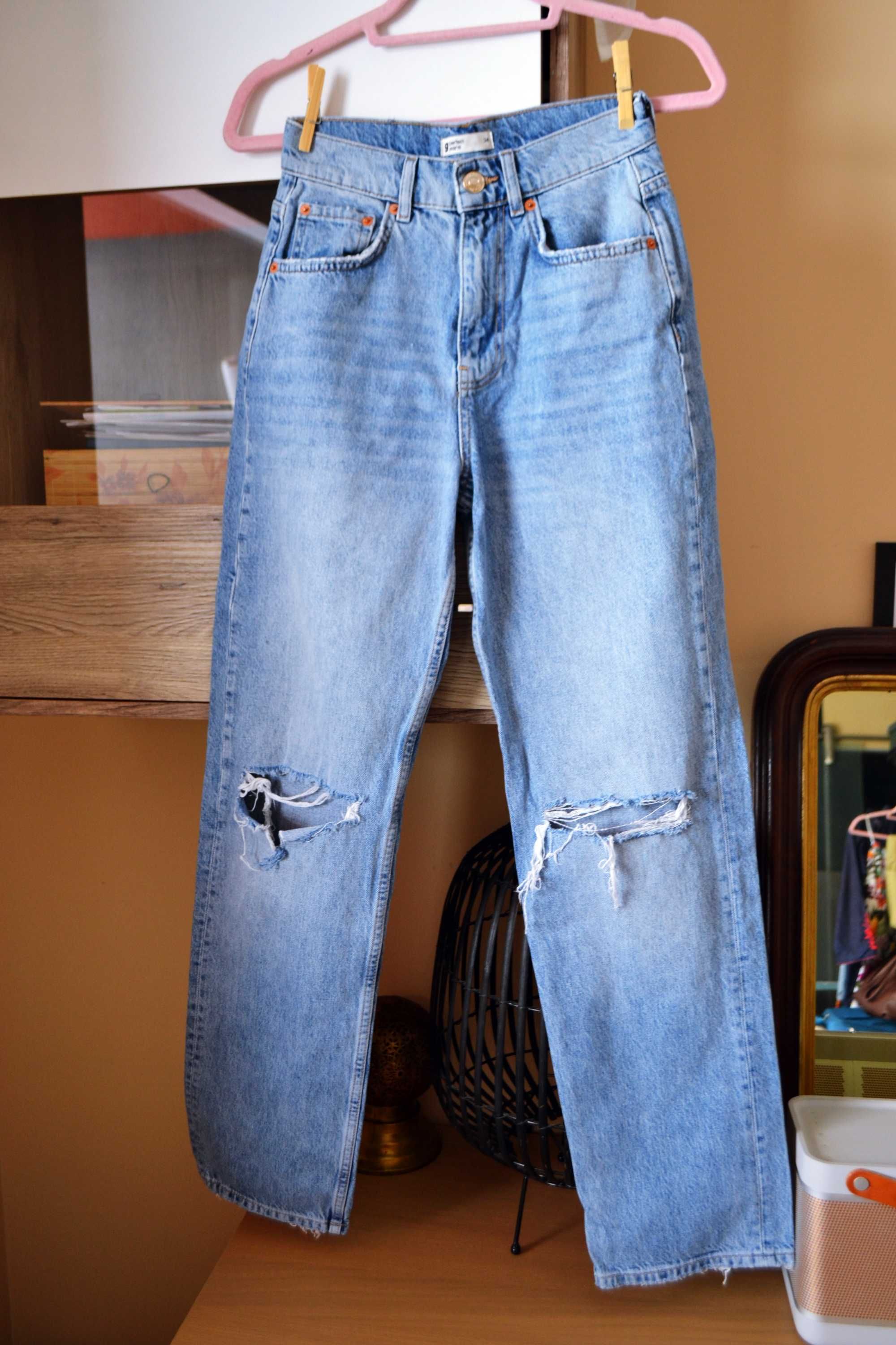 Jeansy dźinsy z wysokim stanem jasne z dziurami przetarcia 34 jeans