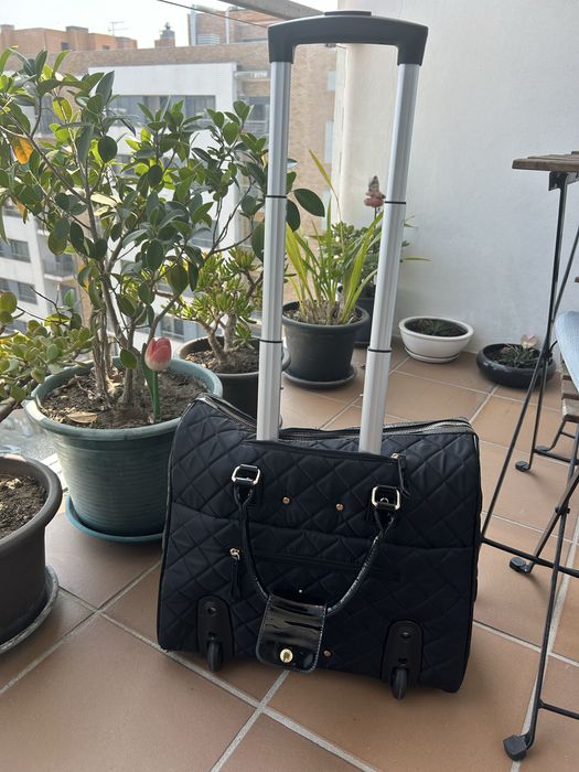 Mala de viagem ou computador Parfois