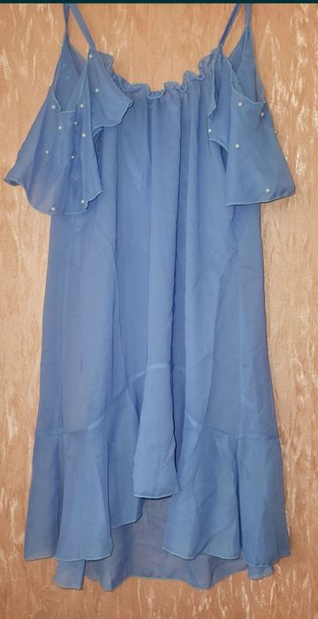 Туника парео с воланом на плечах и жемчугом 44р
Длина 88
Пог 44