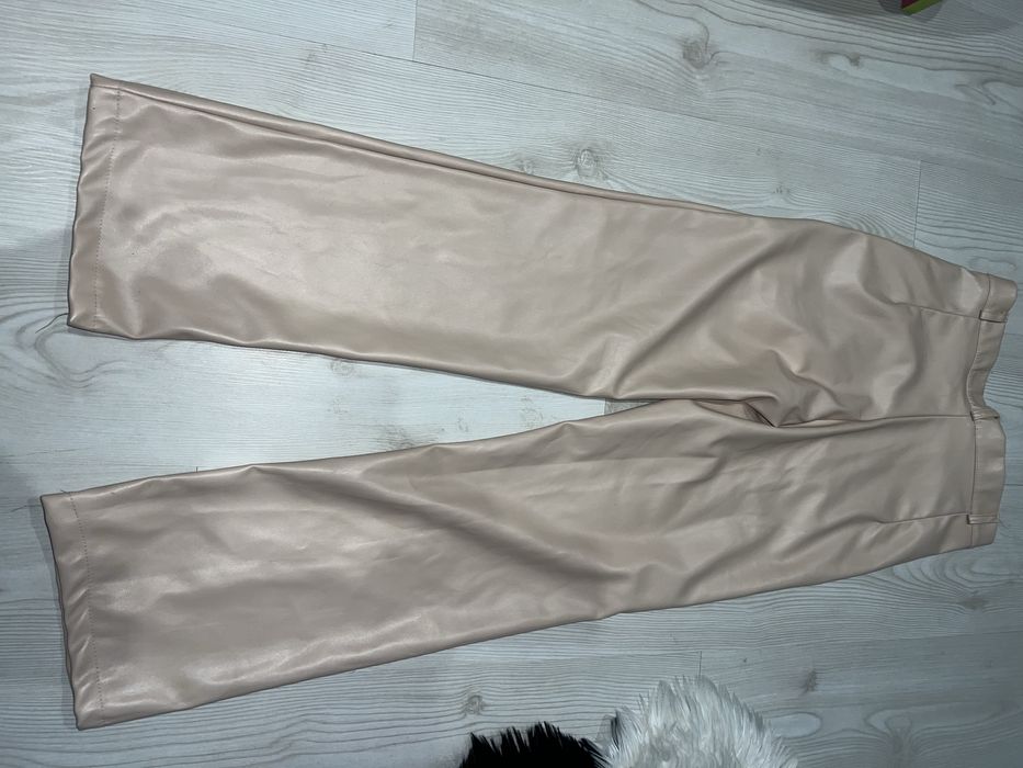 Шкіряні бежеві штани