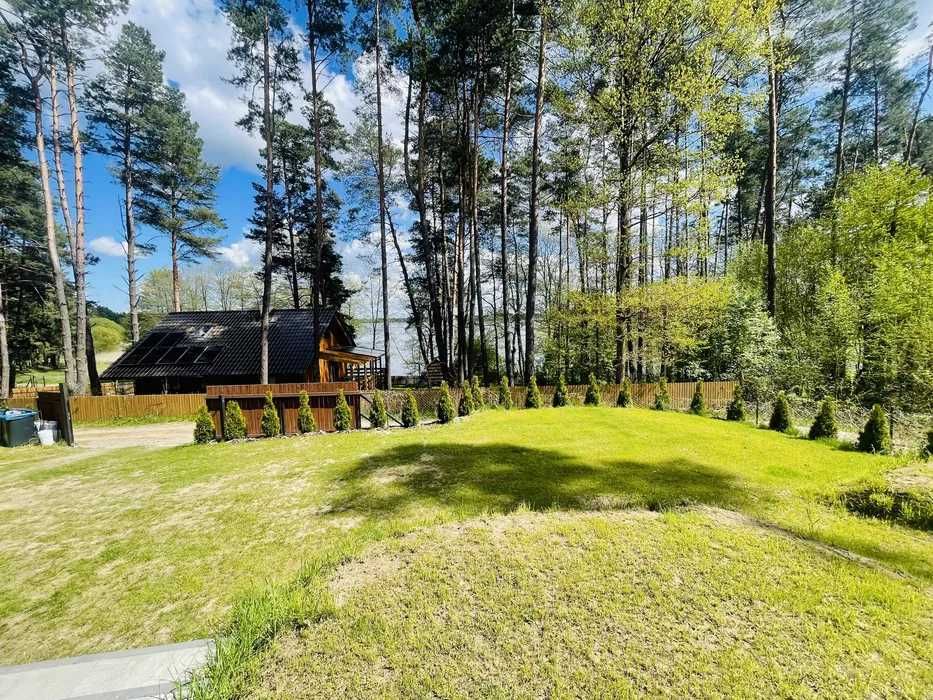 Domek z widokiem na jezioro z balią, łódką i supami  .Bogaczewo 94B