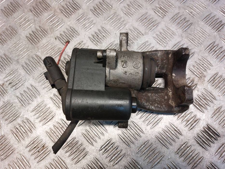 ZACISK HAMULCOWY LEWY TYŁ VOLKSWAGEN PASSAT B6