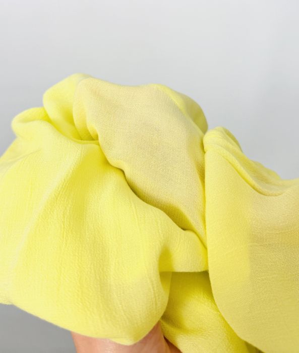 Cytrynowa bluzka z transparentnego materiału i szerokimi rękawami L 40