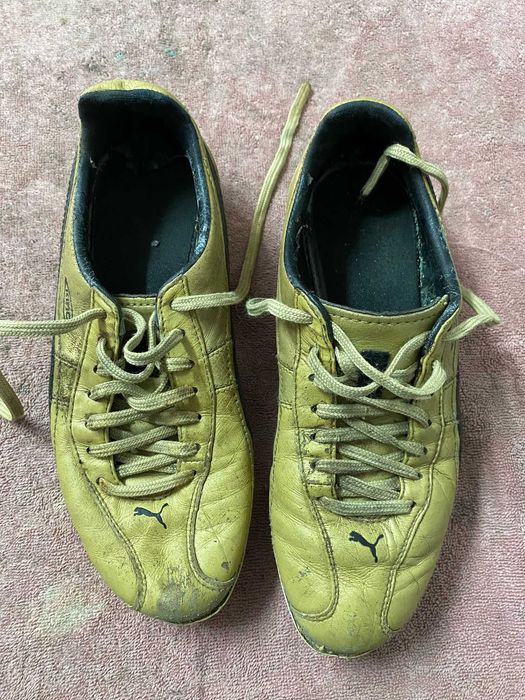 chuteiras Puma King douradas