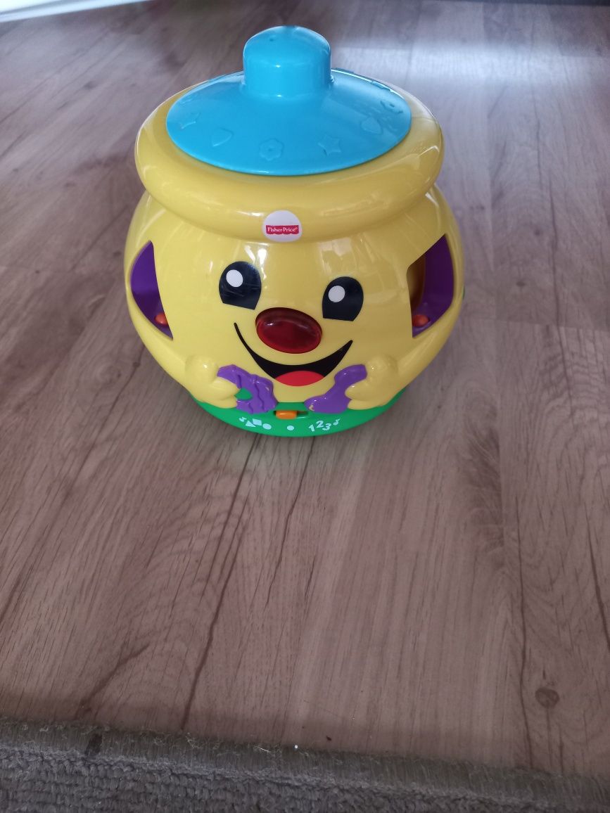 Sprzedam  garnuszek  Fisher price z klockami