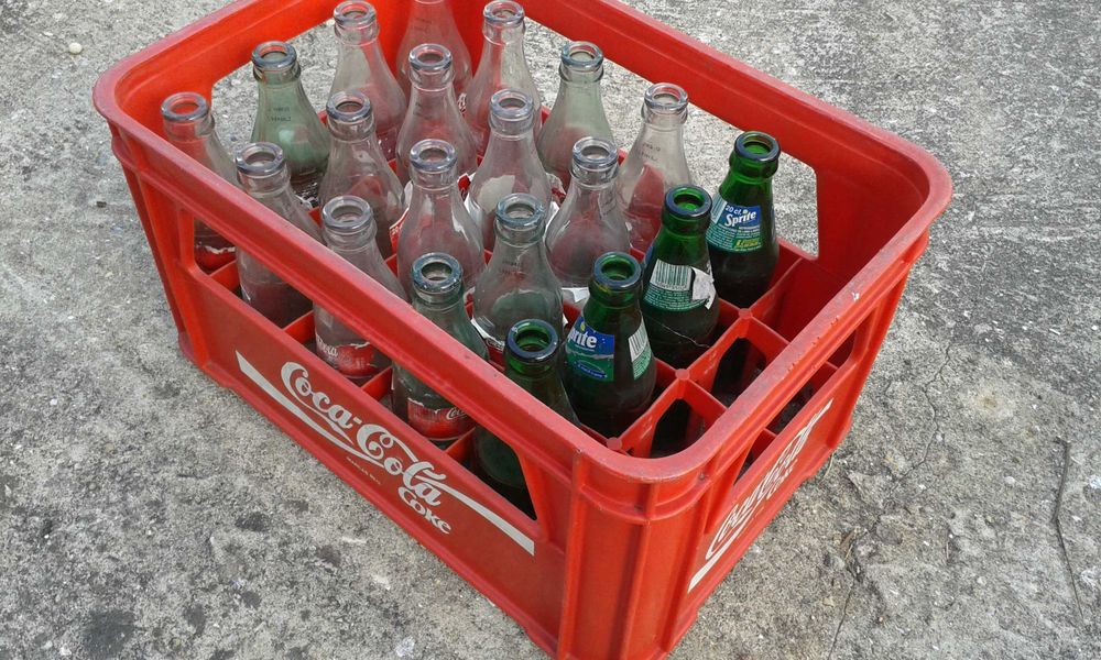 Grade Coca Cola com Garrafas