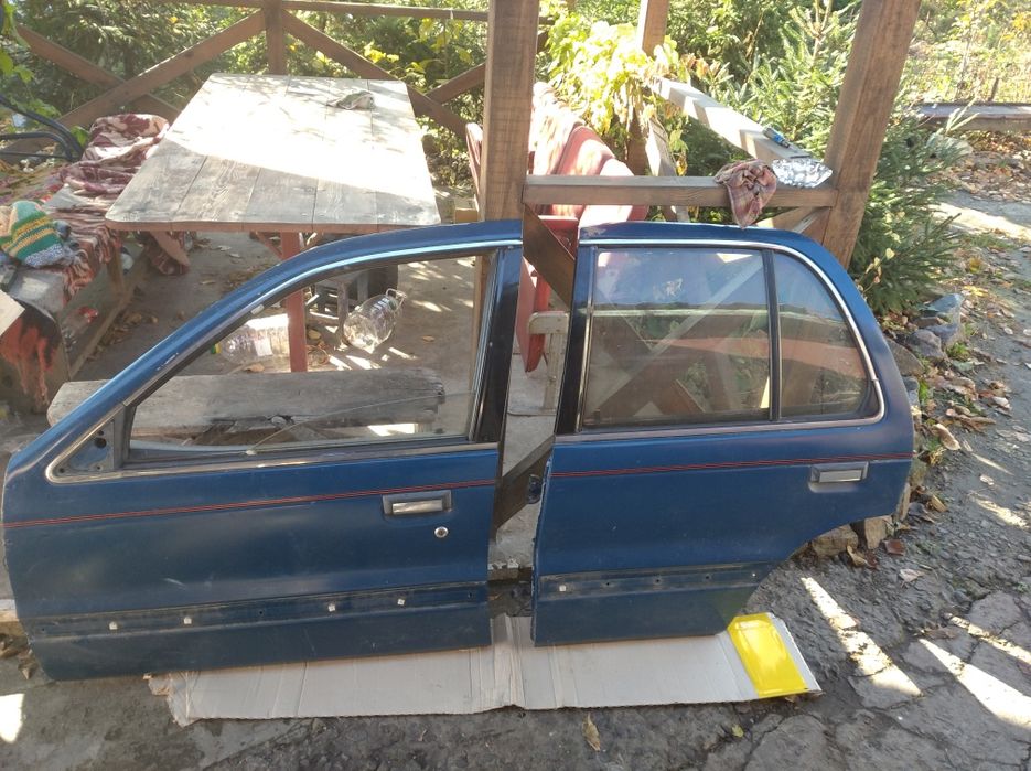 Двери Мицубиси Лансер 88-91г.в.