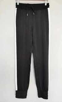 Czarne dżersejowe spodnie H&M
