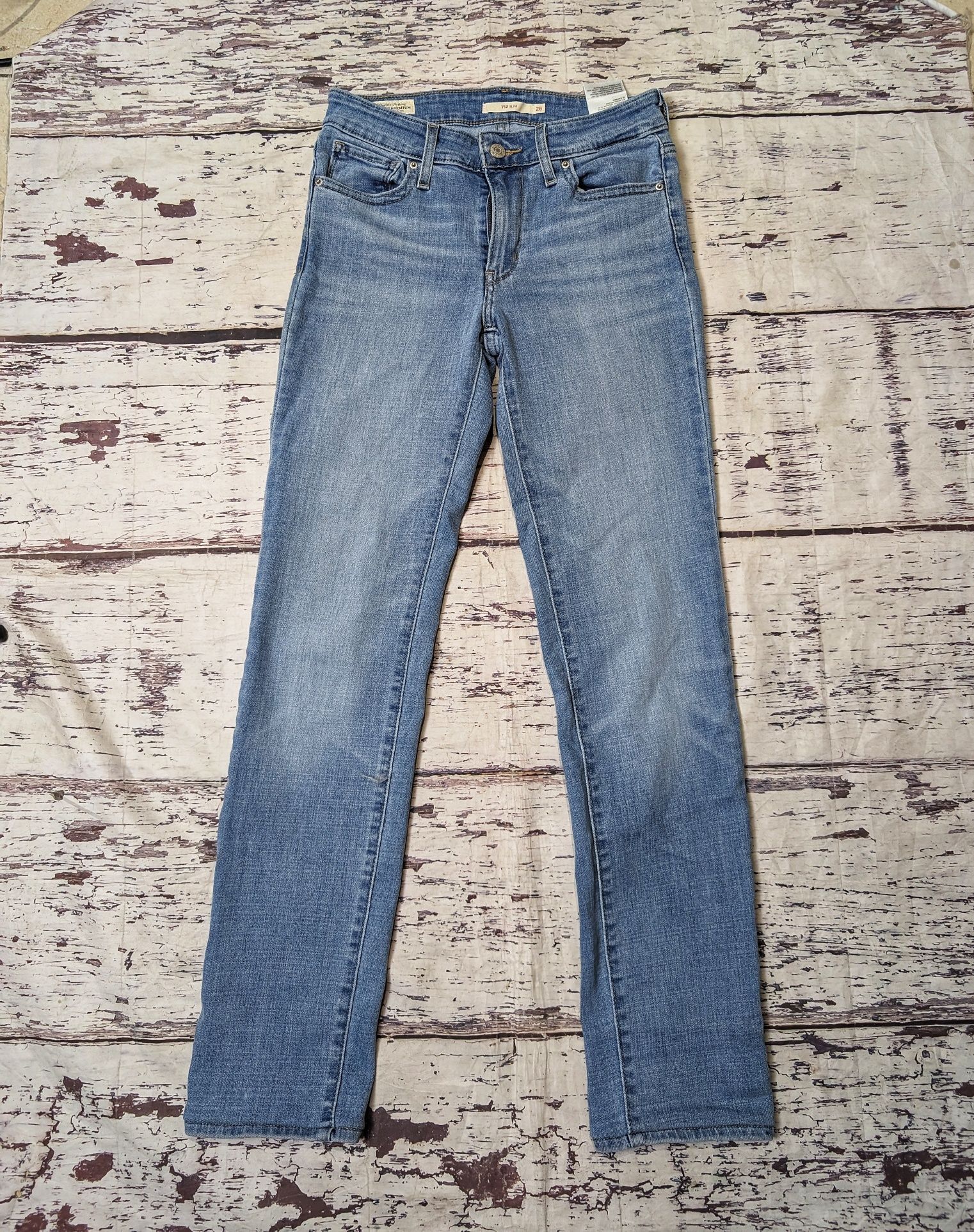 Jasnoniebieskie spodnie jeansowe jeansy Levi's Levis 712 slim w26 l32