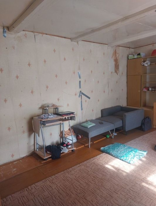 Dom drewniany z murowaną przybudowka.