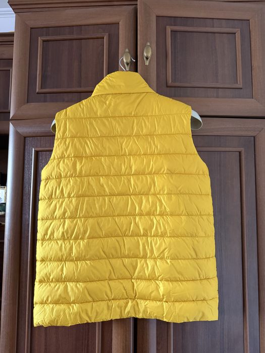 Нова жіноча жилетка