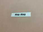 Karton firmy Miu Miu
