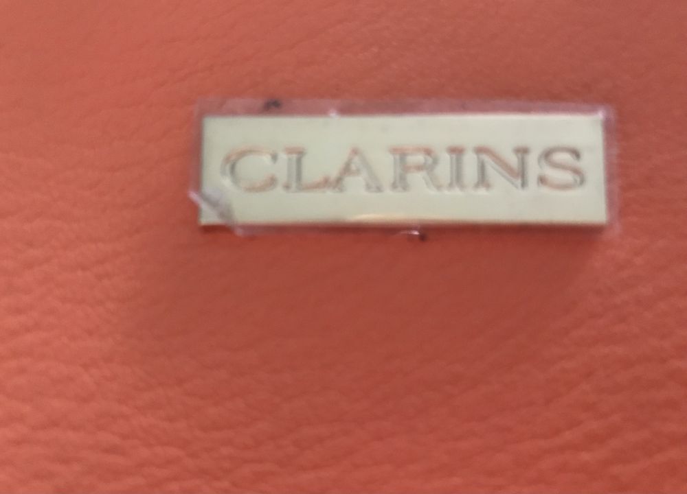 Kosmetyczka Clarins  i zestaw kosmetykow