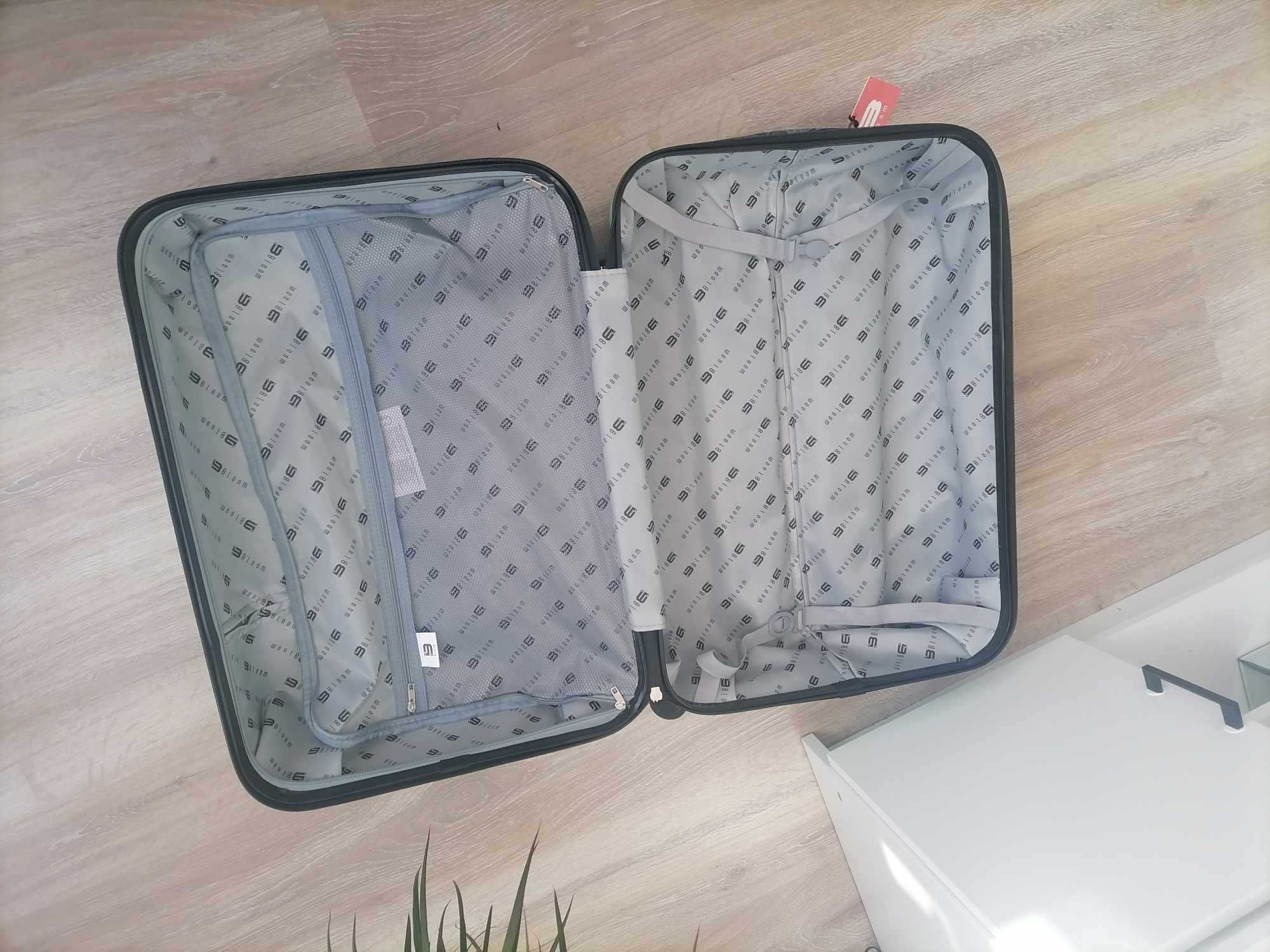 Walizka średnia XL kółka obrotowe nowa samolot