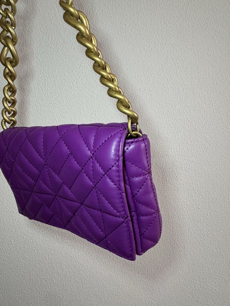 Mala roxa da Zara