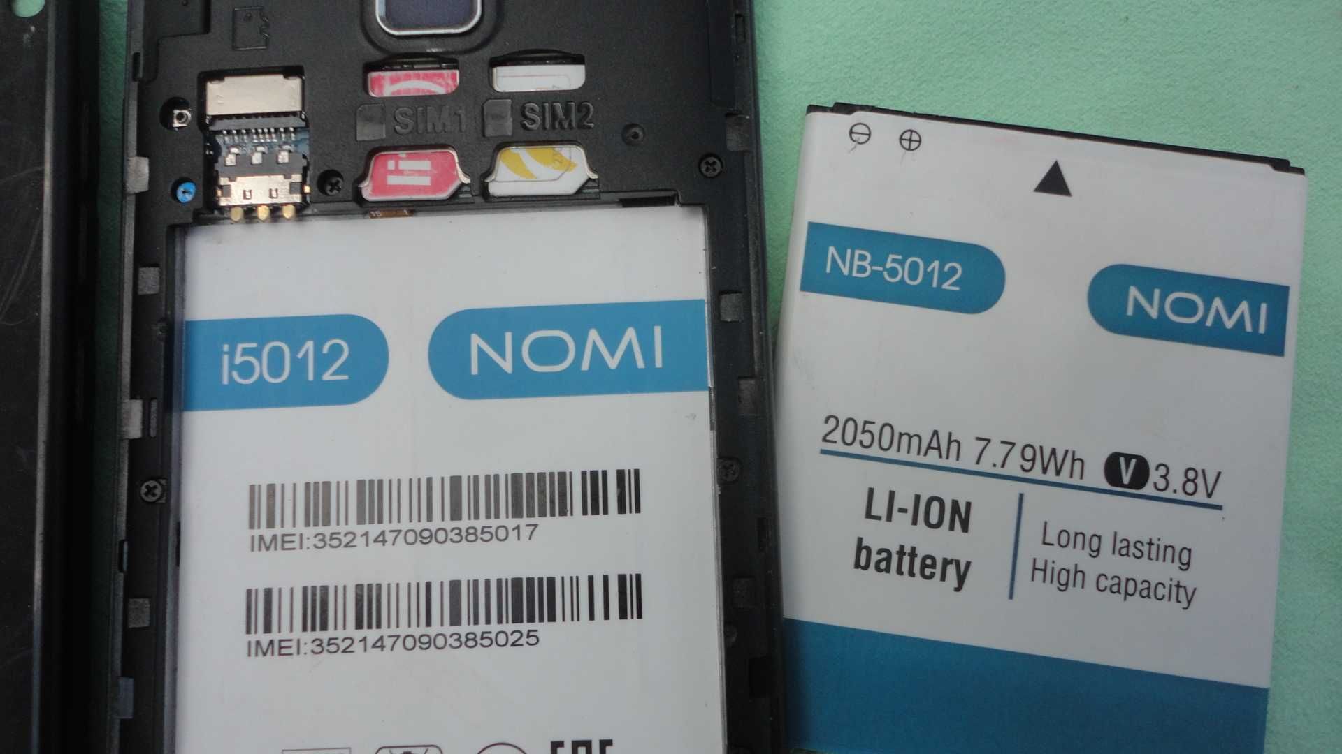 тел. NOMI I5012 под ремонт, батарея NB-5012 оригинал.