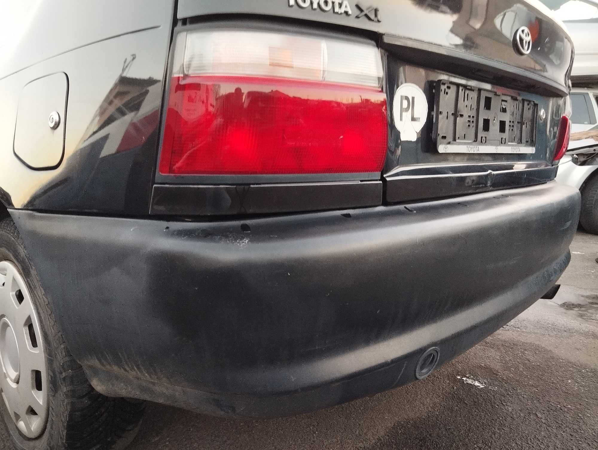 Toyota Corolla AE100 1.4i 3D 1996r.Zderzak tylny.