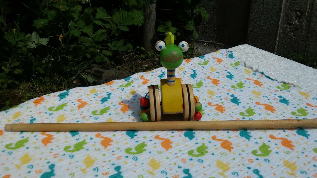 Деревянная игрушка-каталка динозавр Bino толкалка толкачка толкушка