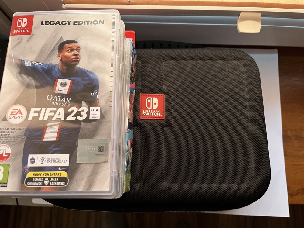 Nintendo Switch OLED + 6 gier + pokrowiec | Pokémon, Mario, FIFA