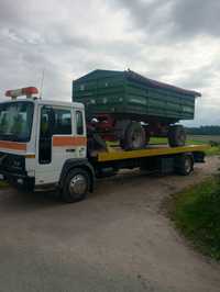 Transport  maszyn rolniczych budowlanych., wózków widłowych Pomoc drog