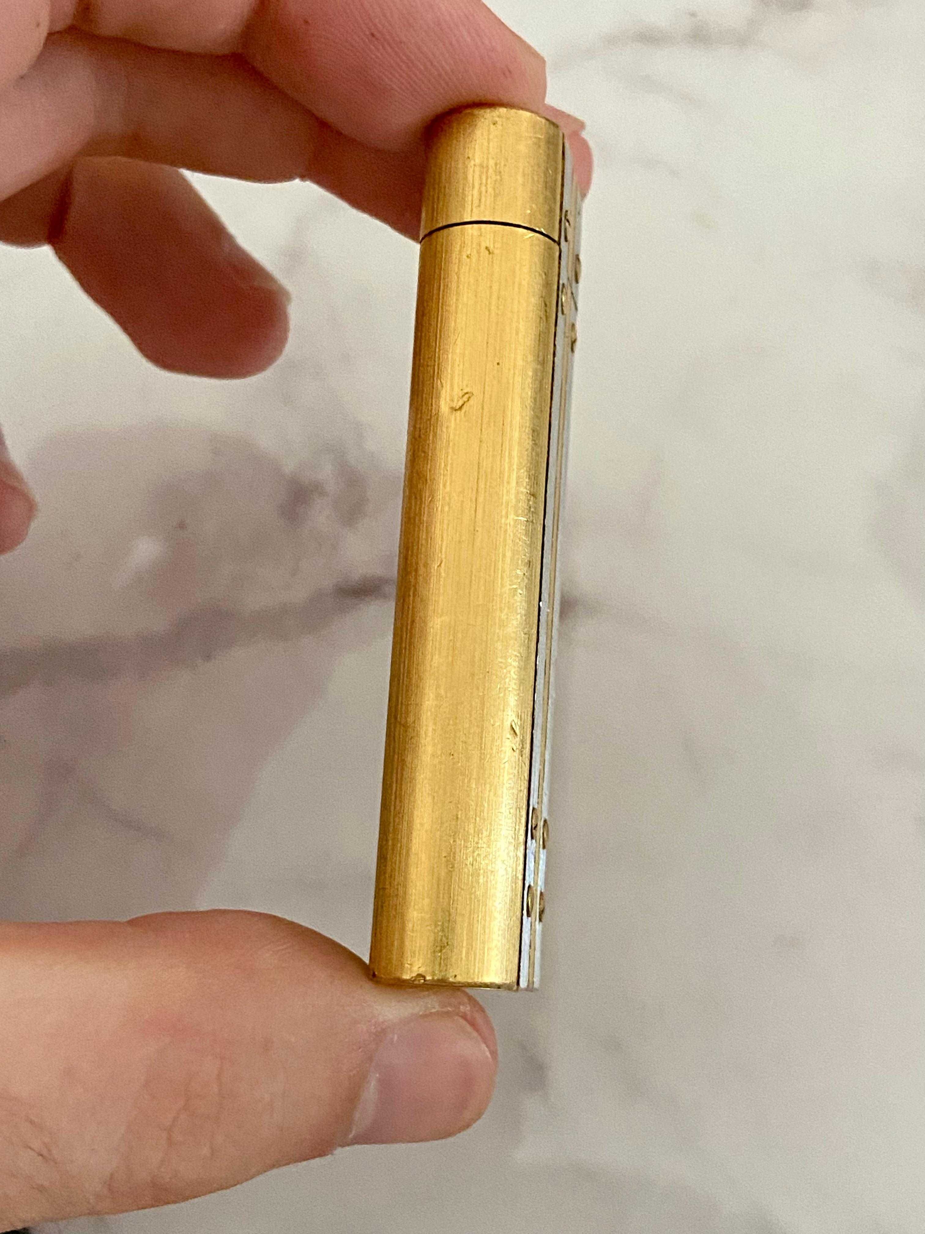 Isqueiro Cartier Santos Prateado e Dourado