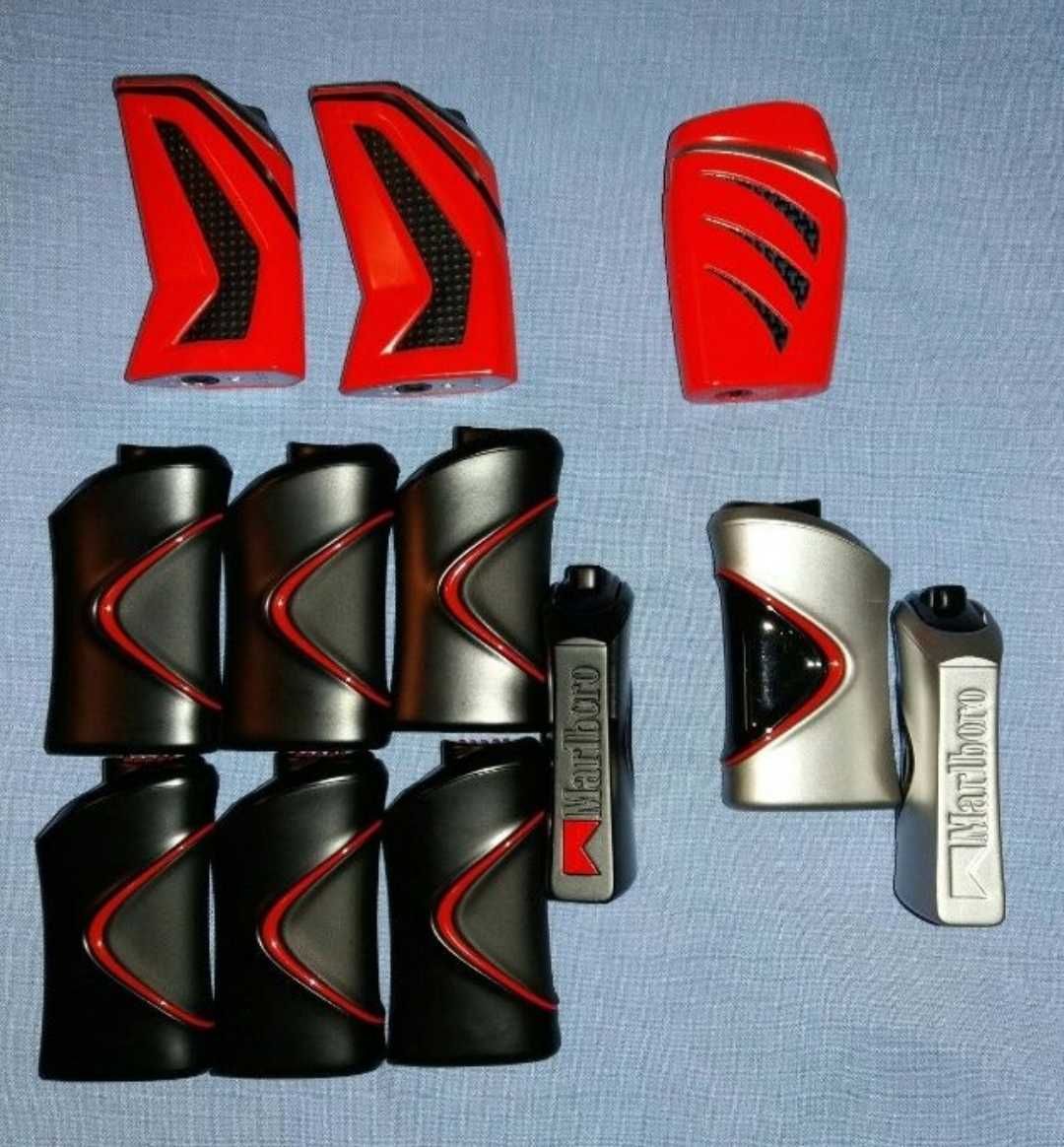 Conjunto de 26 isqueiros e 10 porta-isqueiros com publicidade