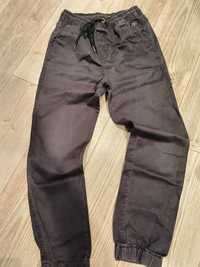 Super spodnie chinos Reserved dla chłopca r. 158cm