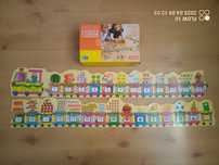 Drewniany pociąg puzzle z liczbami i kształtami