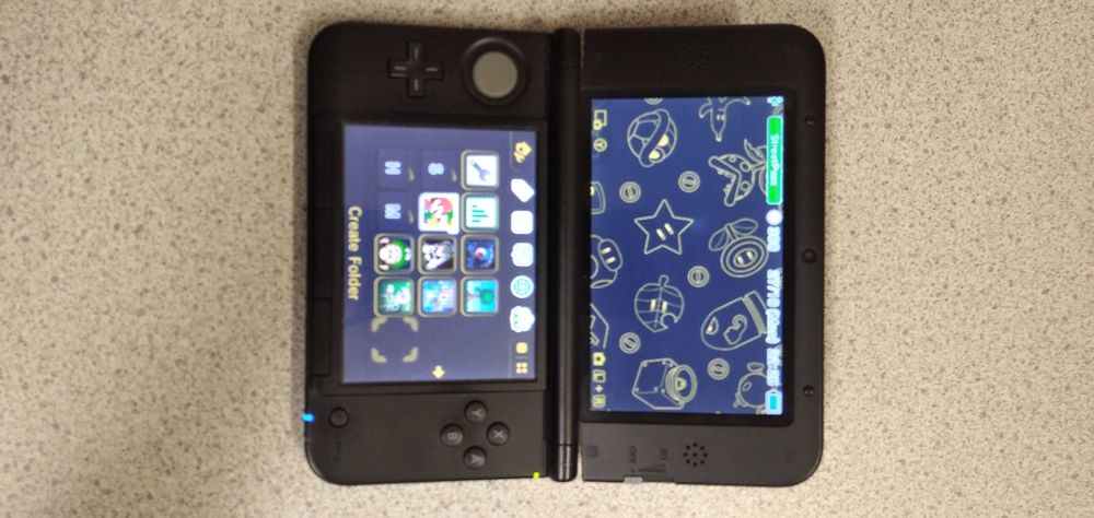 Nintendo 3DS XL i 4 gry