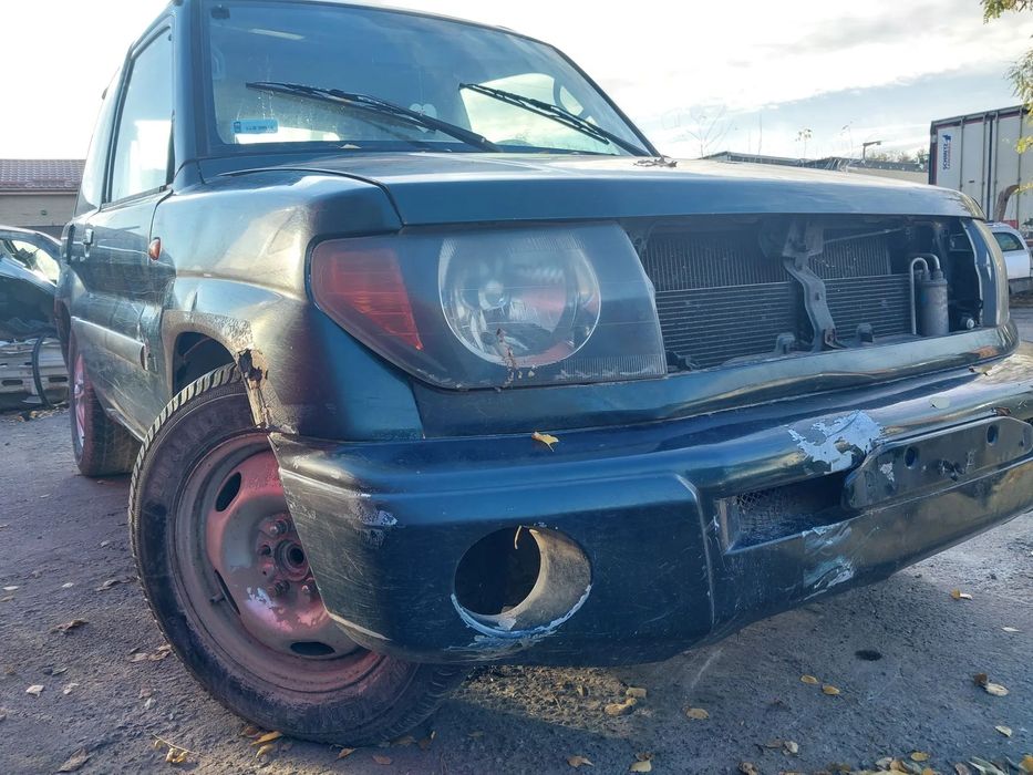Mitsubishi Pajero Pinin I silnik 1.8 GDI klapa szyba maska most wachacz belka zawieszenie drzwi listwa zderzak koło felga zacisk konsola manetka panel obudowa osłona błotnik tył tylny przód przedni zderzak dyferencjał lewarek ćwiartka ramka szyby czołowej