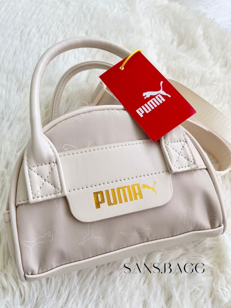 Сумка від бренду Puma в молочному кольорі