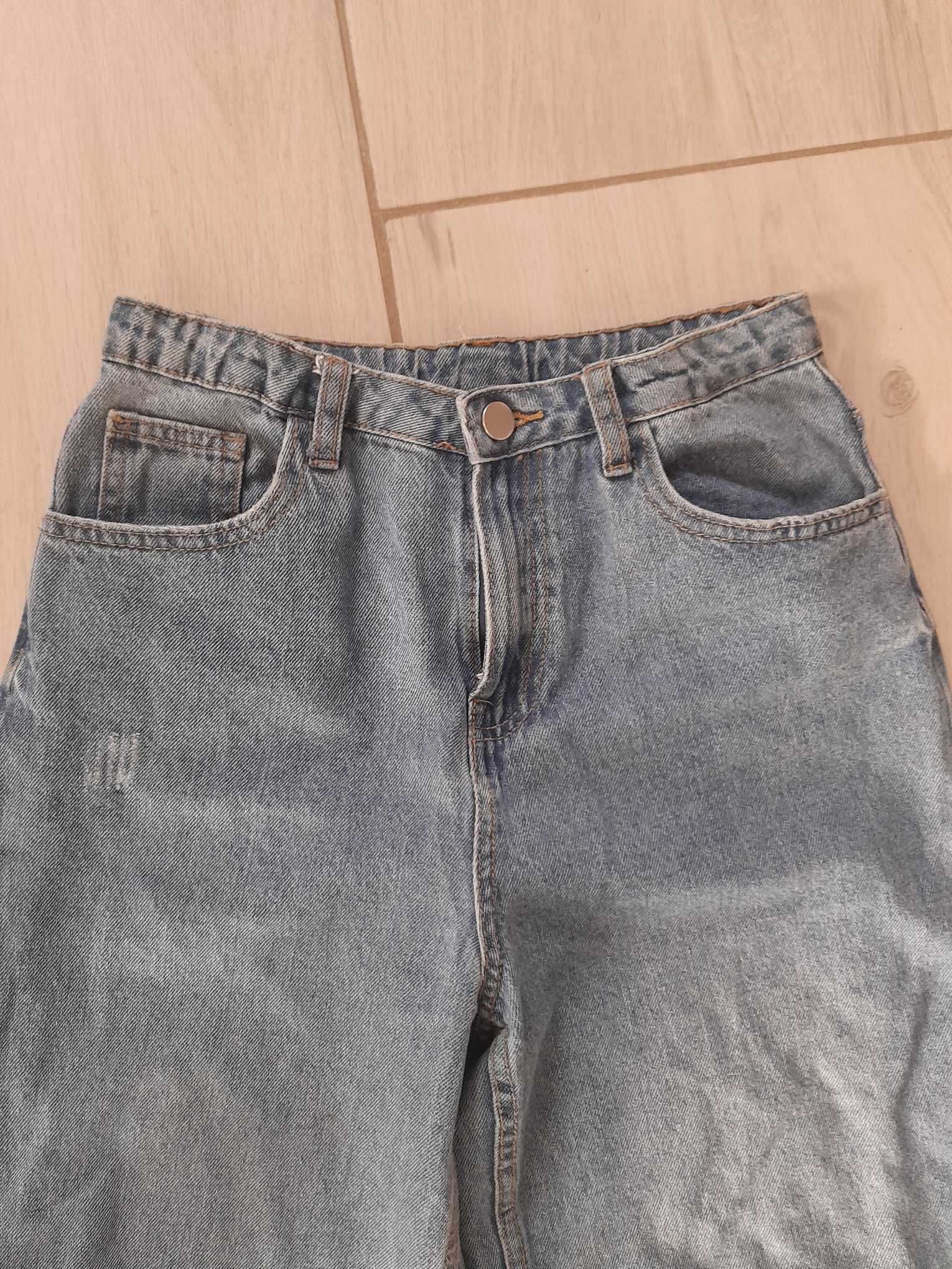 Spodnie jeans dziewczęce z dziurami rozmiar 165