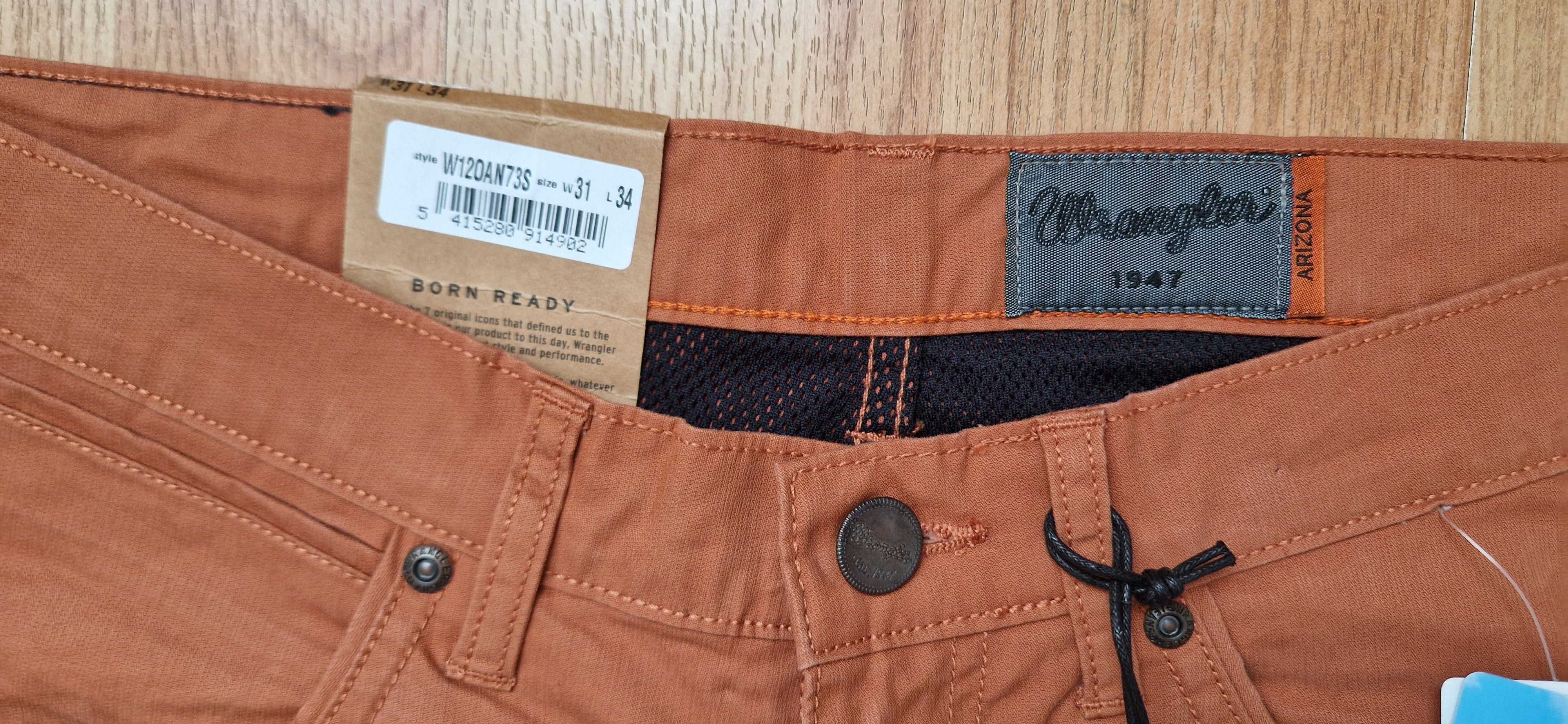 Nowe pomarańczowe spodnie męskie jeans Wrangler Arizona W31l34