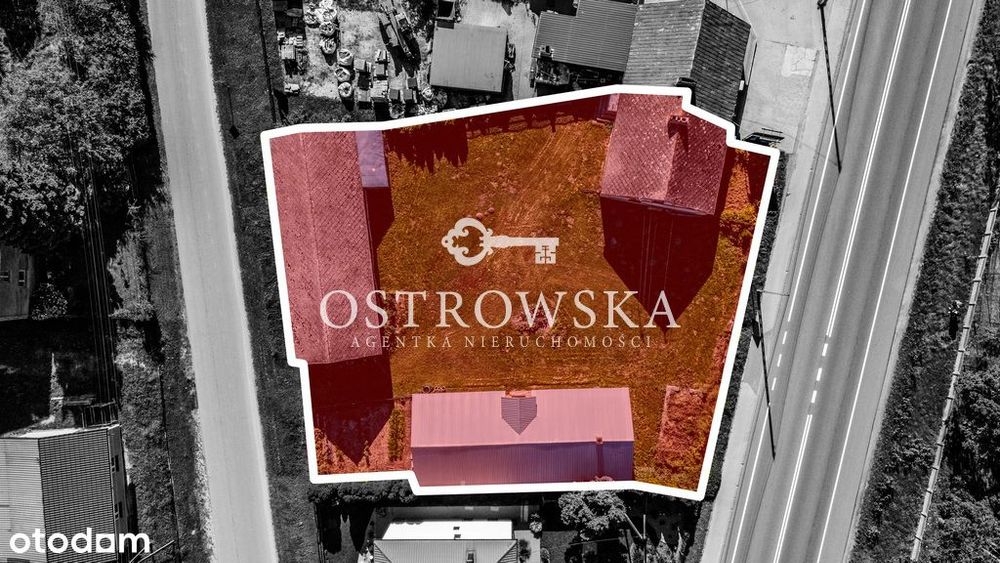 Działka budowlana z połówką bliźniaka i budynkami