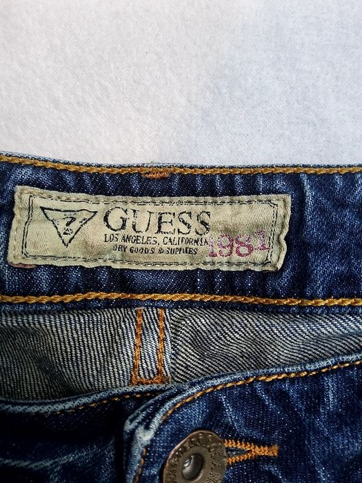Guess - męskie spodnie jeansowe z dziurami i przetarciami