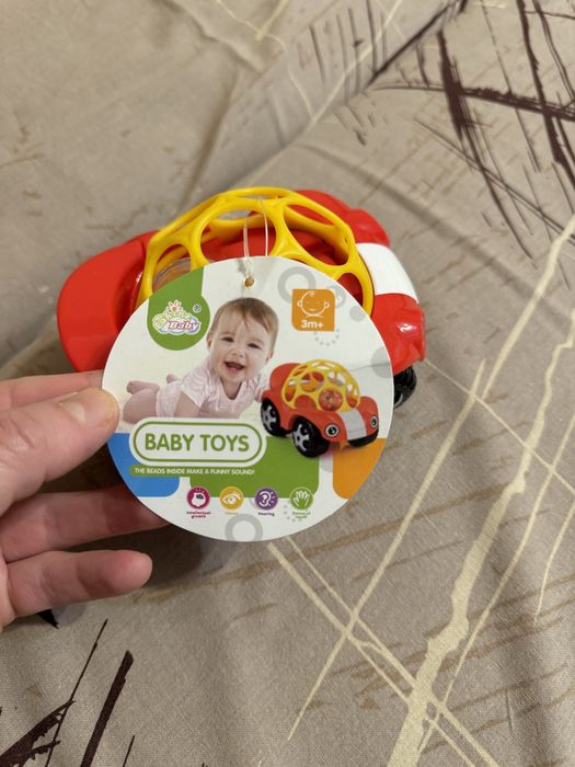 Автомобіль-брязкальце іграшка