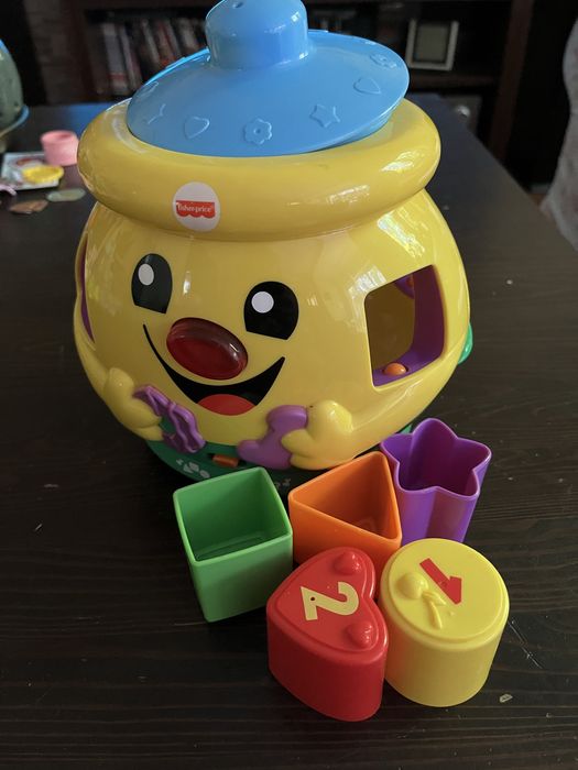 Garnuszek na klocuszek Fisher Price