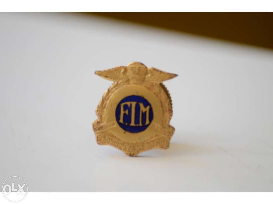 Emblema F. I. Motociclismo