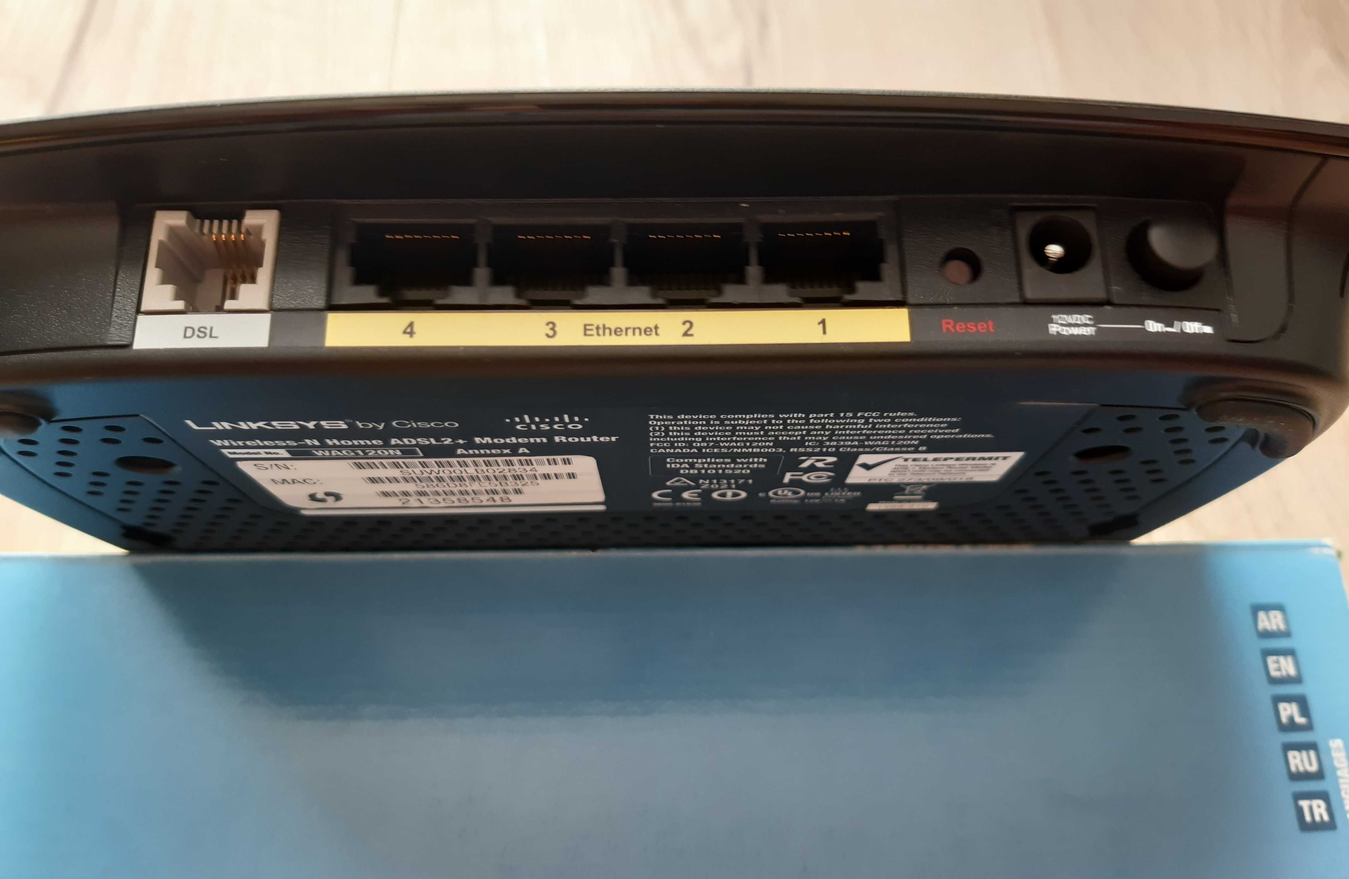 Router Cisco Linksys model WAG120N, oraz router Sagem Fast 2704 Orange