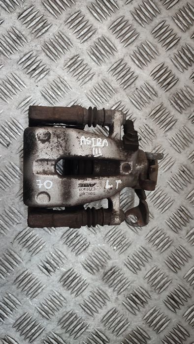 Opel Astra H III zacisk hamulcowy lewy tył tylny